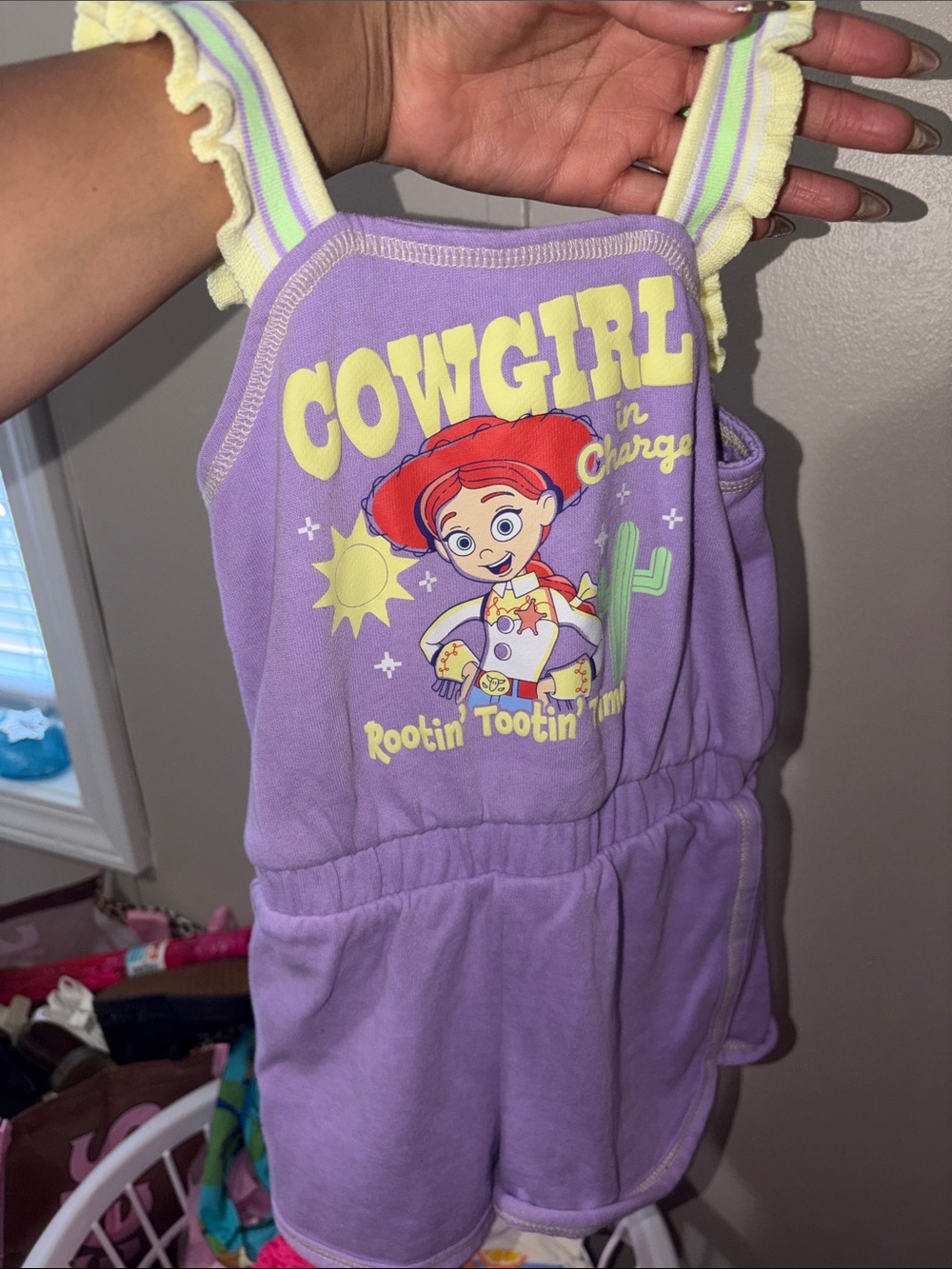 Disney Purple and Yellow Jessie Cowgirl Romper